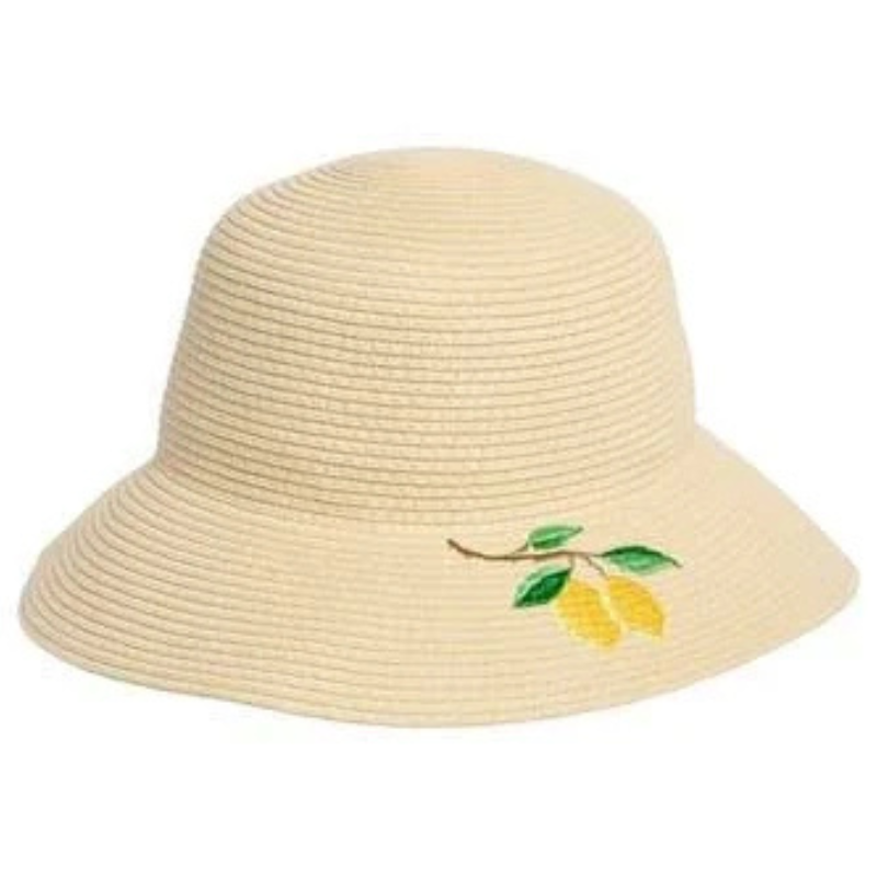 A beige woven hat with a wide brim, featuring an embroidered design of lemons and green leaves on the side.