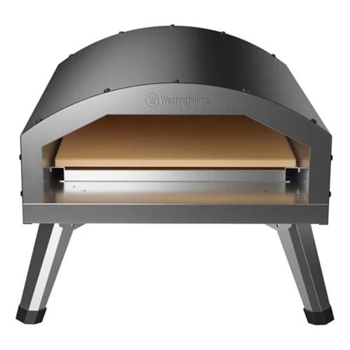 The oven is a compact, dome-shaped electric pizza oven with metallic legs and a visible stone baking surface. It features the Westinghouse logo on the front. Designed for indoor or outdoor use.
