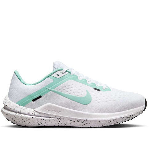 A white running shoe with a green swoosh logo and speckled sole.
