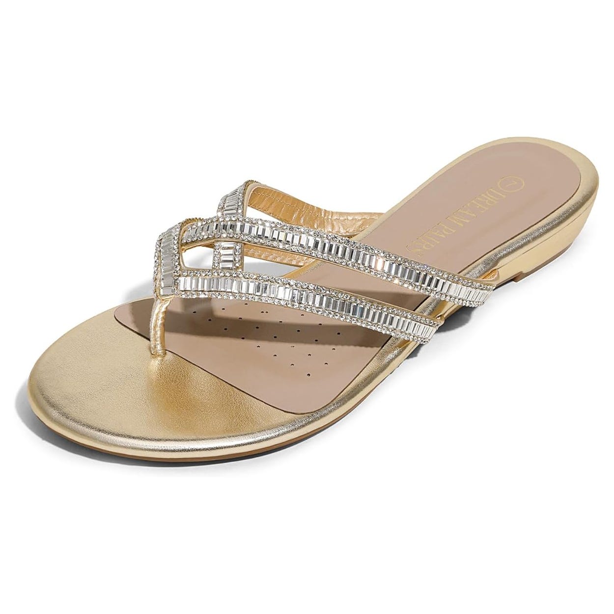 A gold sandal with rhinestone embellishments and a flat sole, featuring a toe post and perforated insole for ventilation.