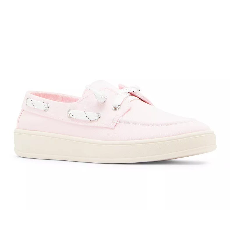 Light pink canvas boat shoe with white laces and a cream-colored rubber sole.