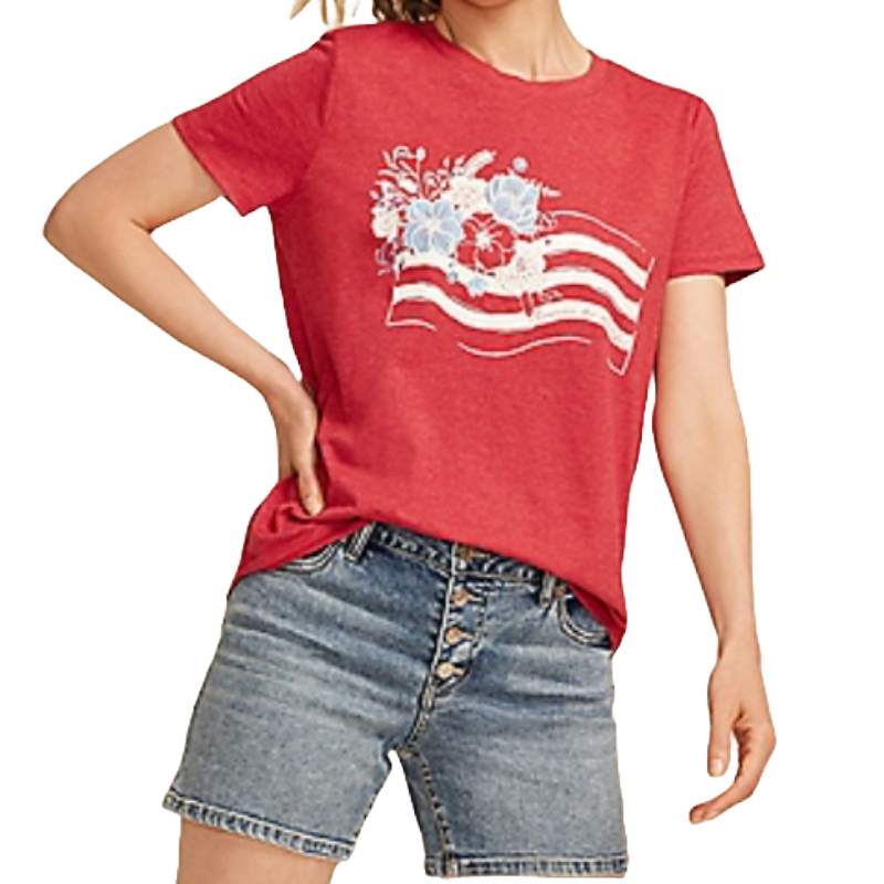 Red short-sleeve T-shirt with a floral flag graphic featuring red, white, and blue flowers and wavy stripes, paired with button-up denim shorts.