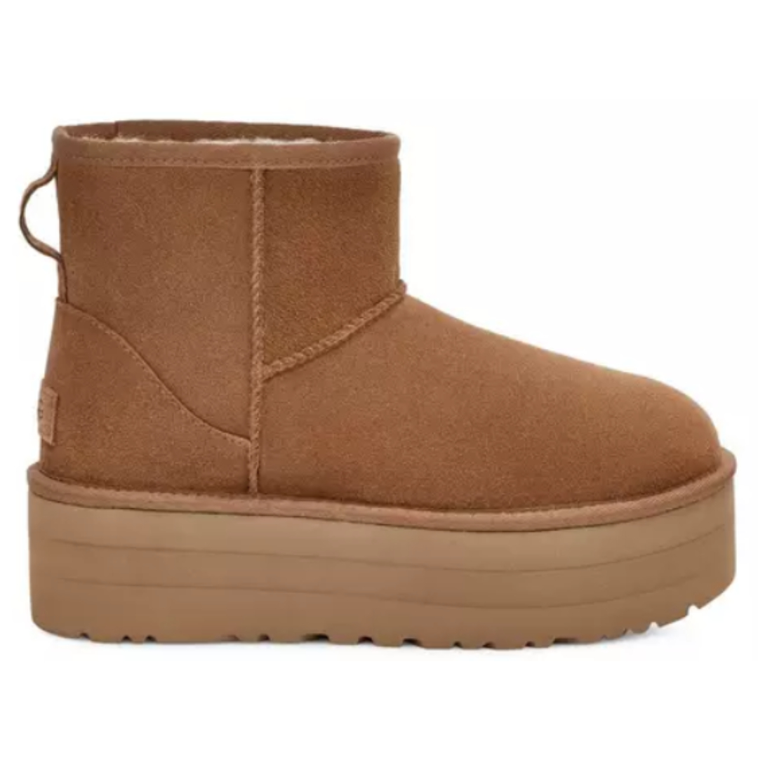 Brown suede platform ankle boot with a pull tab, featuring a thick sole and seam detailing.