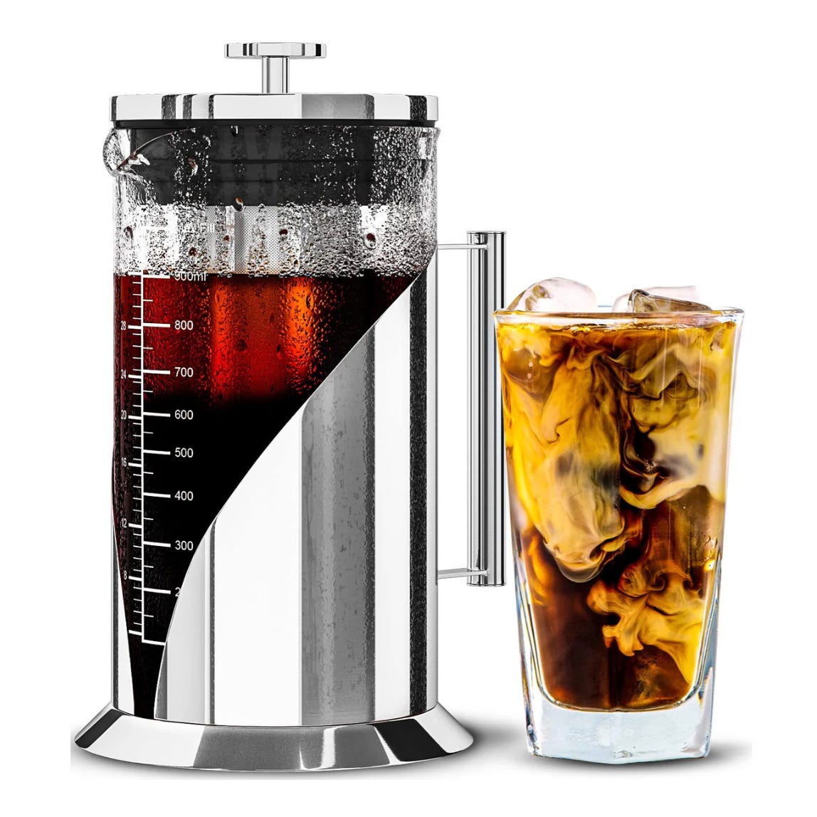 A French press coffee maker with measurement markings is filled with a dark liquid, placed next to a glass of iced coffee showing swirls of cream.