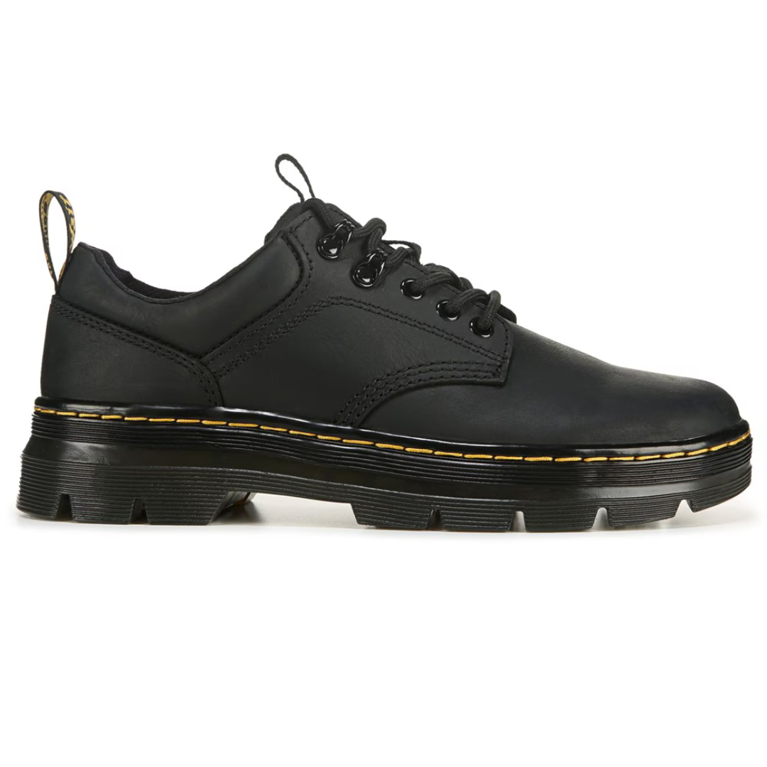 A pair of black leather shoes with yellow stitching and thick rubber soles.