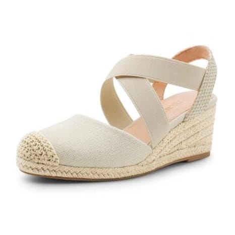 Women's wedge espadrilles with beige canvas upper and cross-straps, featuring a woven jute heel and toe cap, ideal for casual summer wear.
