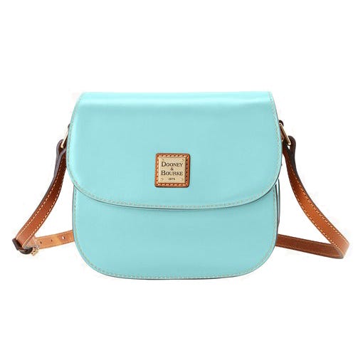 A light blue crossbody bag with a brown adjustable strap and a gold-tone logo plate on the flap.