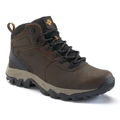Brown Columbia hiking boot with black laces, featuring a high-traction sole and a logo on the side.