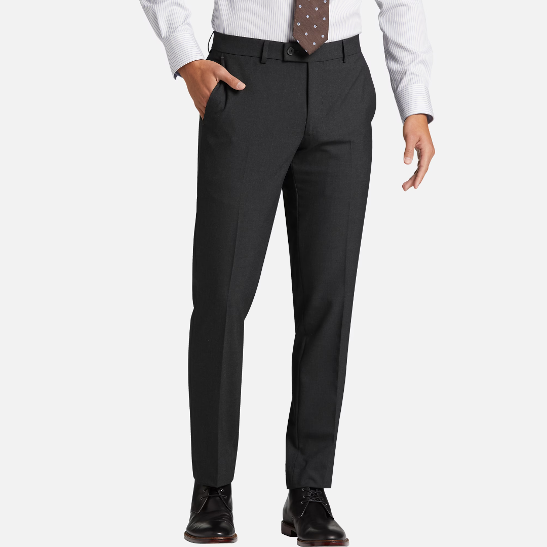 A man wearing a white shirt, patterned tie, charcoal dress trousers, black belt, and black dress shoes.