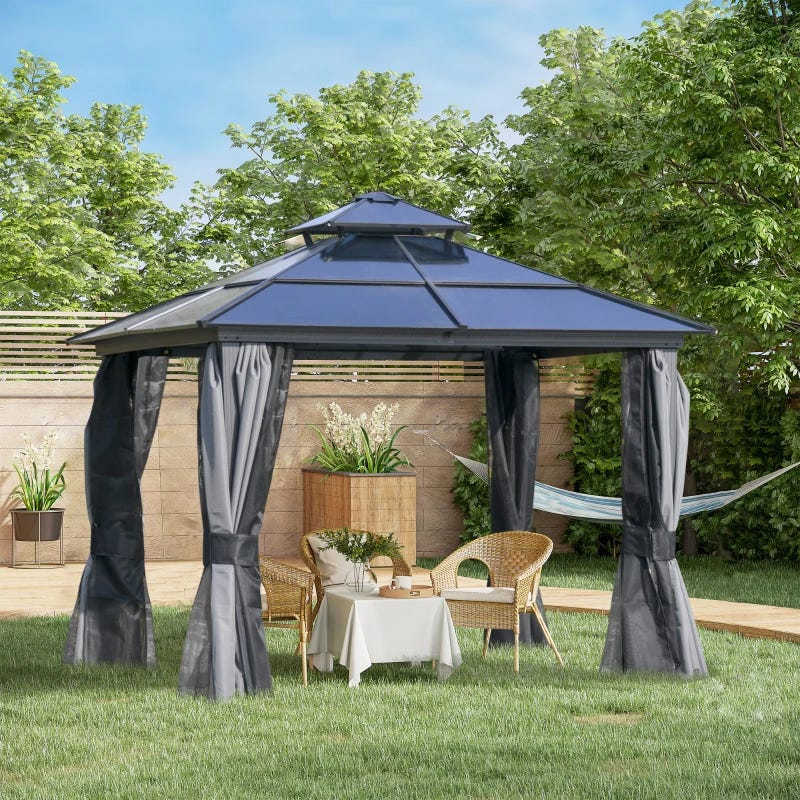 A metal-framed garden gazebo with a fabric canopy and curtains, accompanied by wicker furniture and a hammock.