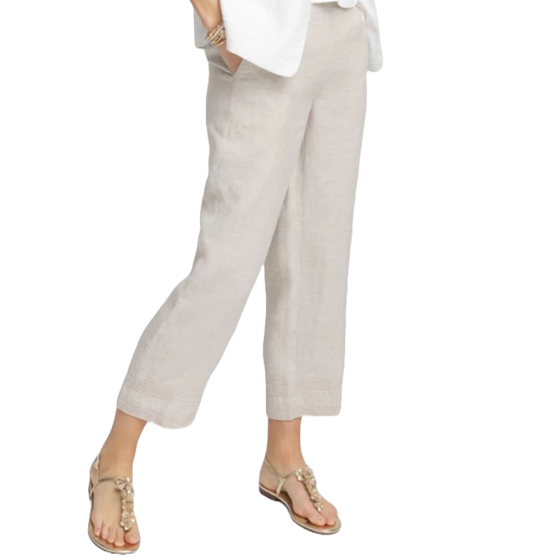Linen cropped pants in a light beige color, featuring a relaxed fit with straight legs. They're styled with a white top and sandals, creating a casual and comfortable look.