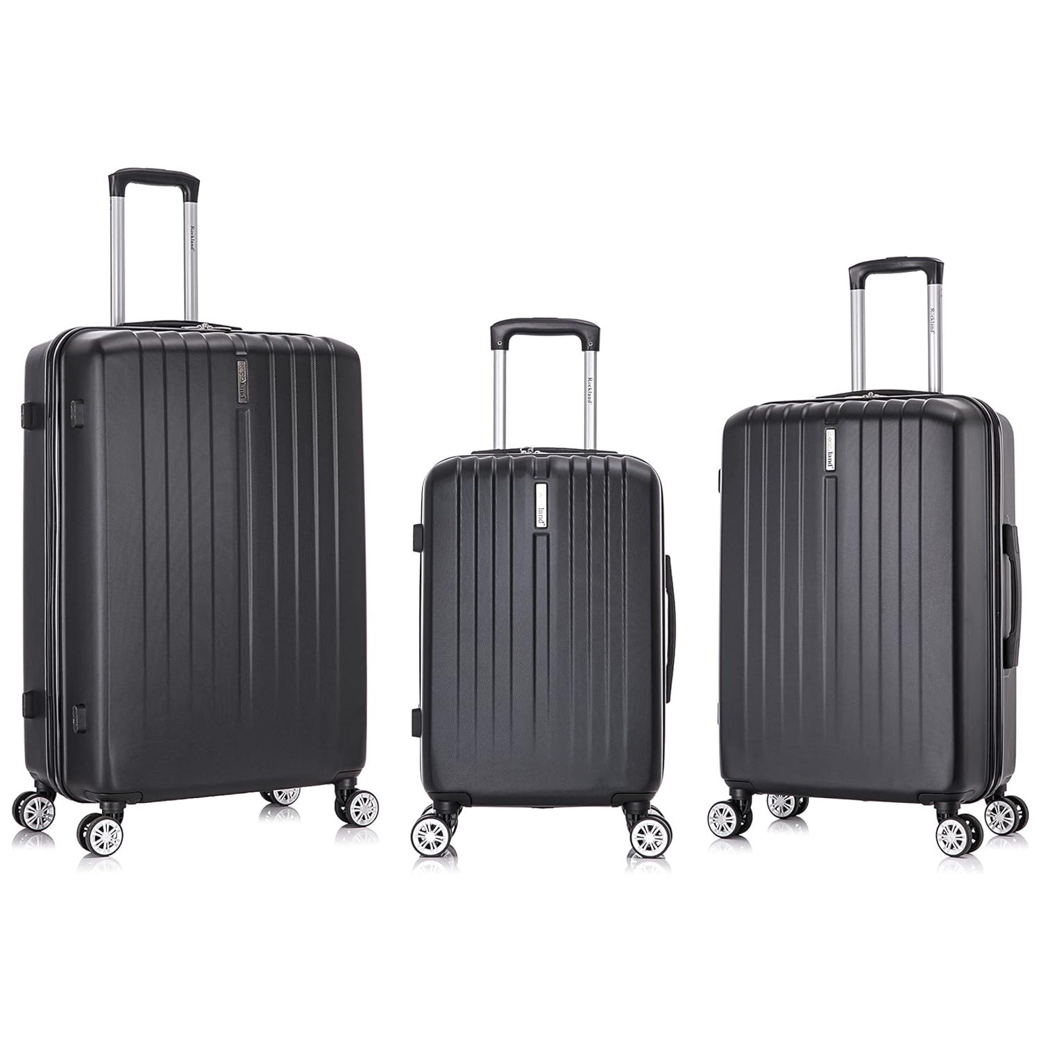Three black hard-shell suitcases of varying sizes with telescopic handles and spinner wheels.