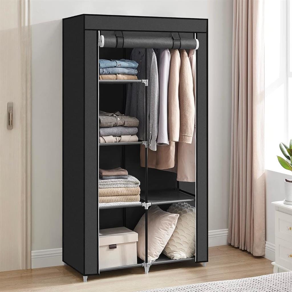 Black wardrobe with clothes, shelves, and a drawer.