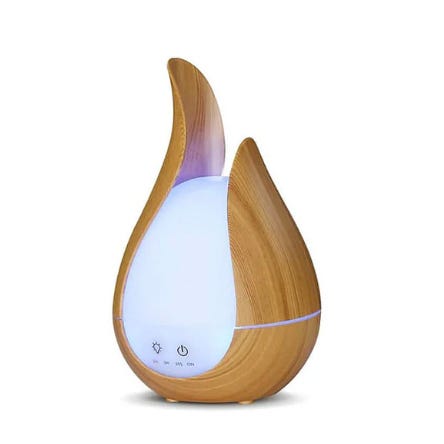 A teardrop-shaped essential oil diffuser and humidifier with a wood grain finish and a luminous central section. It has touch controls for power, lighting, and timer settings.