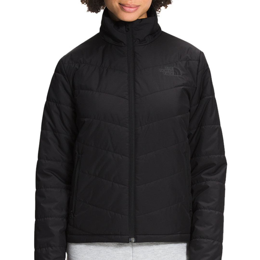 A black quilted jacket with a high neck and a visible logo on the left chest.