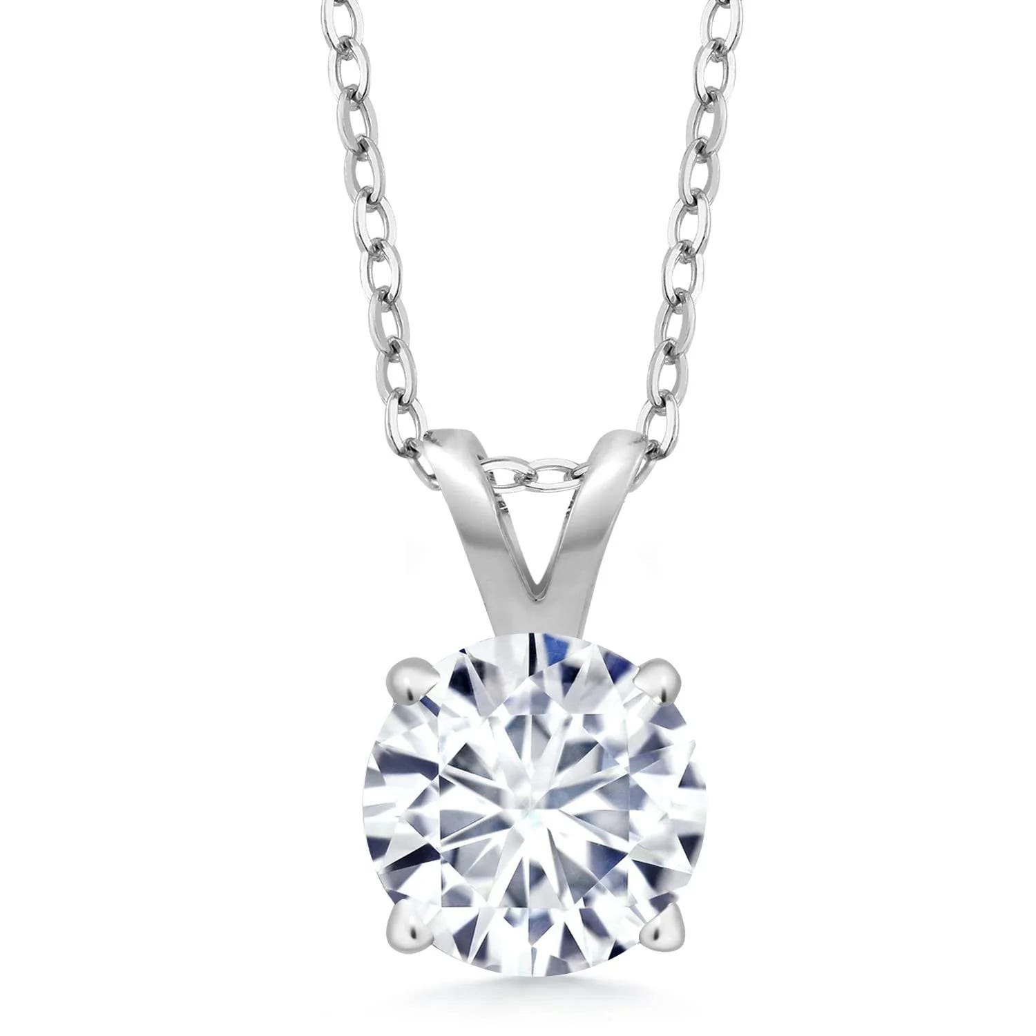A silver necklace featuring a round, faceted gemstone pendant held by a prong setting.