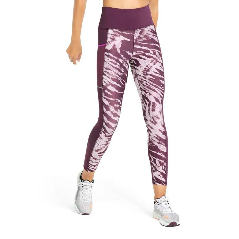 Purple and white patterned athletic leggings paired with white and gray sneakers.