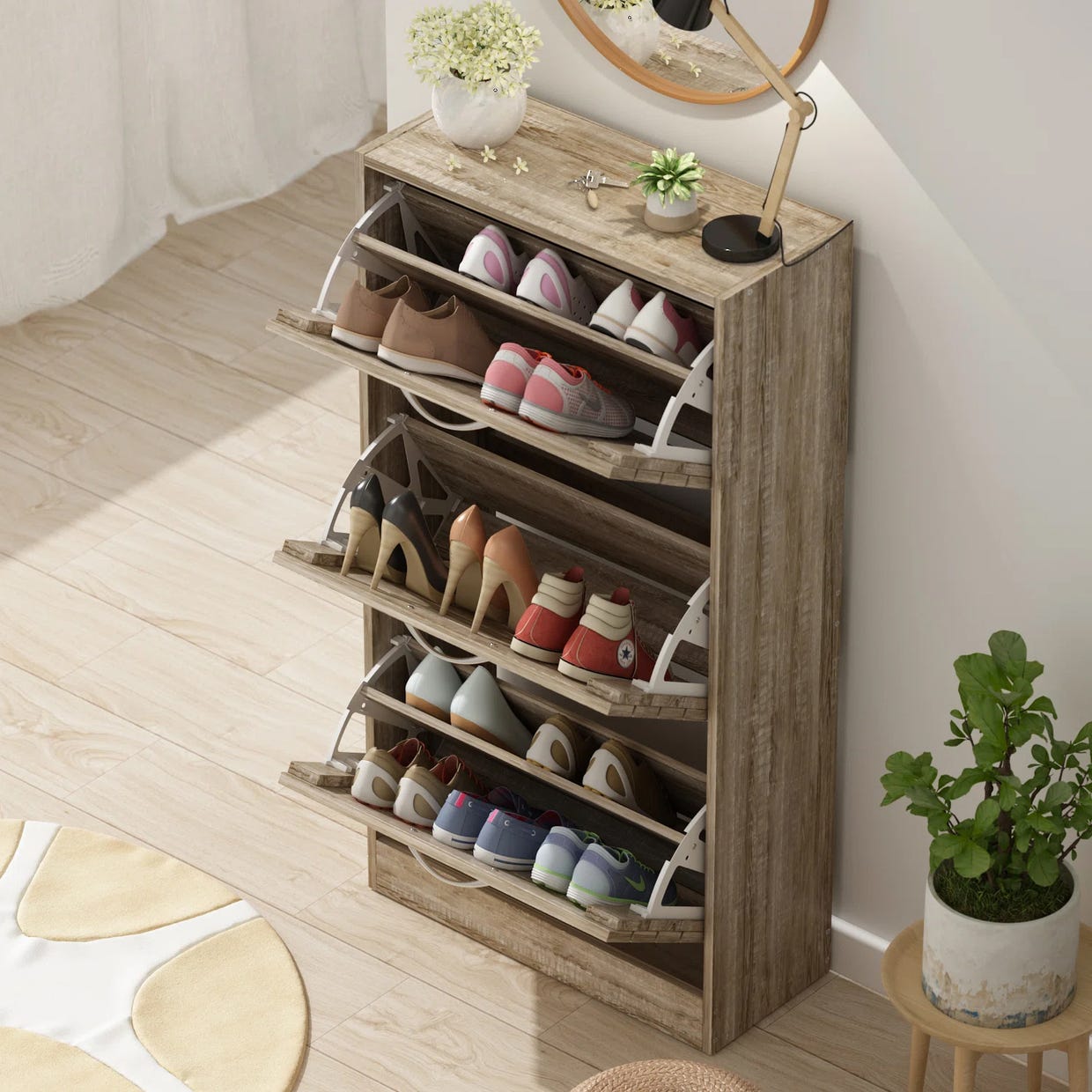 Wooden shoe storage cabinet with multiple compartments and pull-down drawers, holding various footwear pairs.