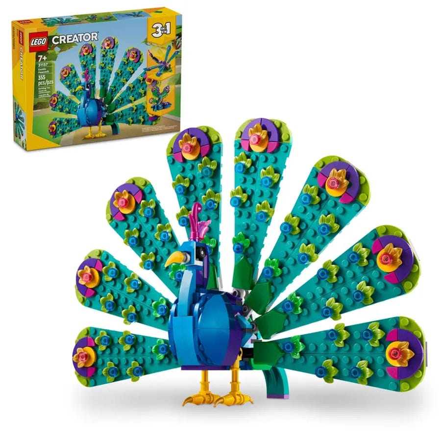 A colorful LEGO Creator set of a peacock with an elaborate tail featuring flowers and multiple shades of blue and green.