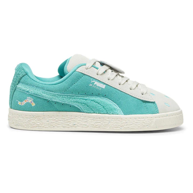 A turquoise and white Puma sneaker featuring suede accents and decorative stitching. It includes branding details and a textured sole.