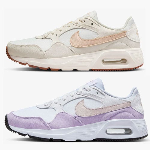 Two pairs of Nike Air Max sneakers, one in beige with a peach swoosh and the other in white with lavender panels.