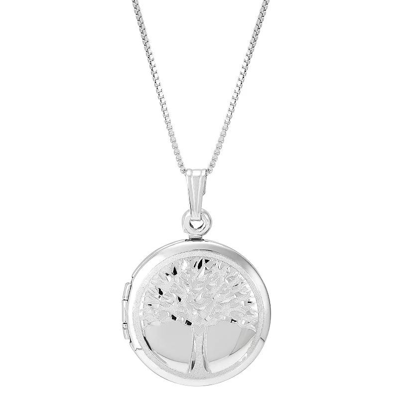 A silver locket necklace featuring a tree design on its round pendant, attached to a delicate chain.