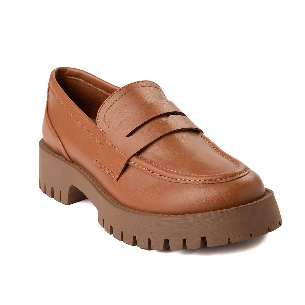 A single brown loafer with chunky soles and a strap across the top.
