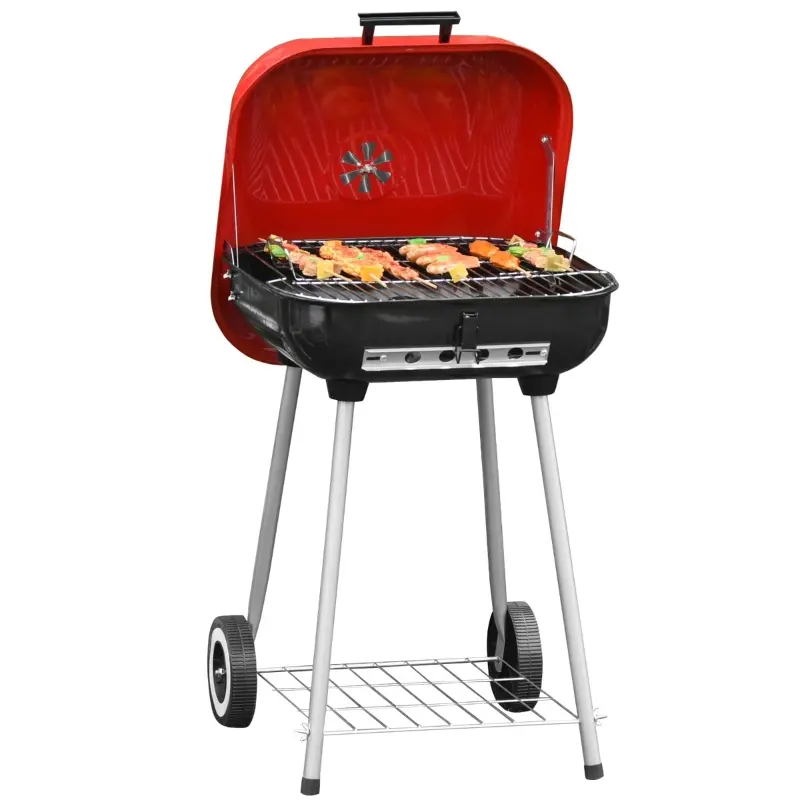 Red and black portable charcoal grill with a lid, two wheels on one side, and a lower wire shelf for storage. Grilled food is on the grate.