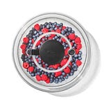 Clear salad spinner with a black pump mechanism on top, filled with a mix of blueberries and raspberries.