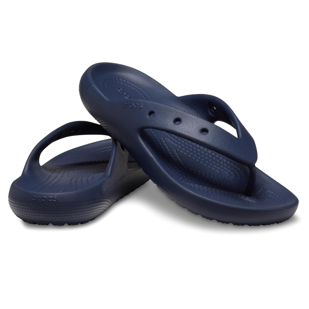 A pair of navy blue flip-flops with a textured insole and strap design.