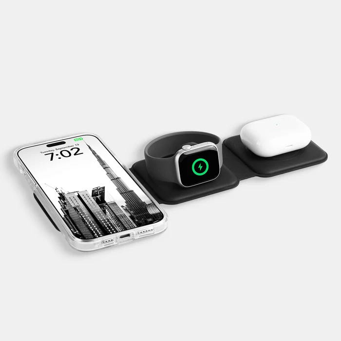 A wireless charging pad with three separate sections for charging a smartphone, a smartwatch, and wireless earbuds simultaneously, presented with a sleek, black design.