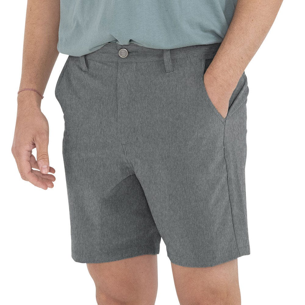 Gray shorts with a button closure and pockets, reaching above the knee. They are made of a fabric that looks like a blend, possibly suited for casual wear or light activities.