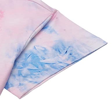 A section of a tie-dye loungewear set is shown, featuring a blend of pink and blue colors on the cloth.