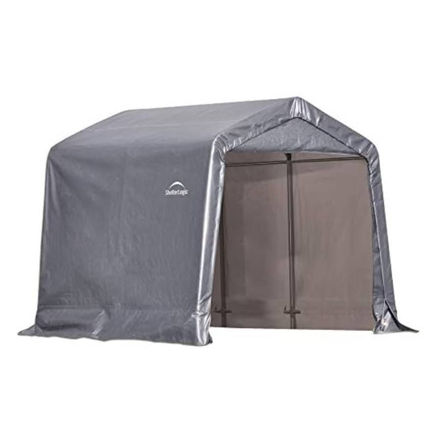 A grey ShelterLogic storage shed with a peaked roof and a roll-up door, designed for outdoor storage and protection of items.