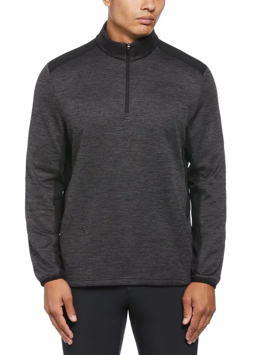 A dark gray, long-sleeved pullover with a high collar and a half-zip closure at the front.