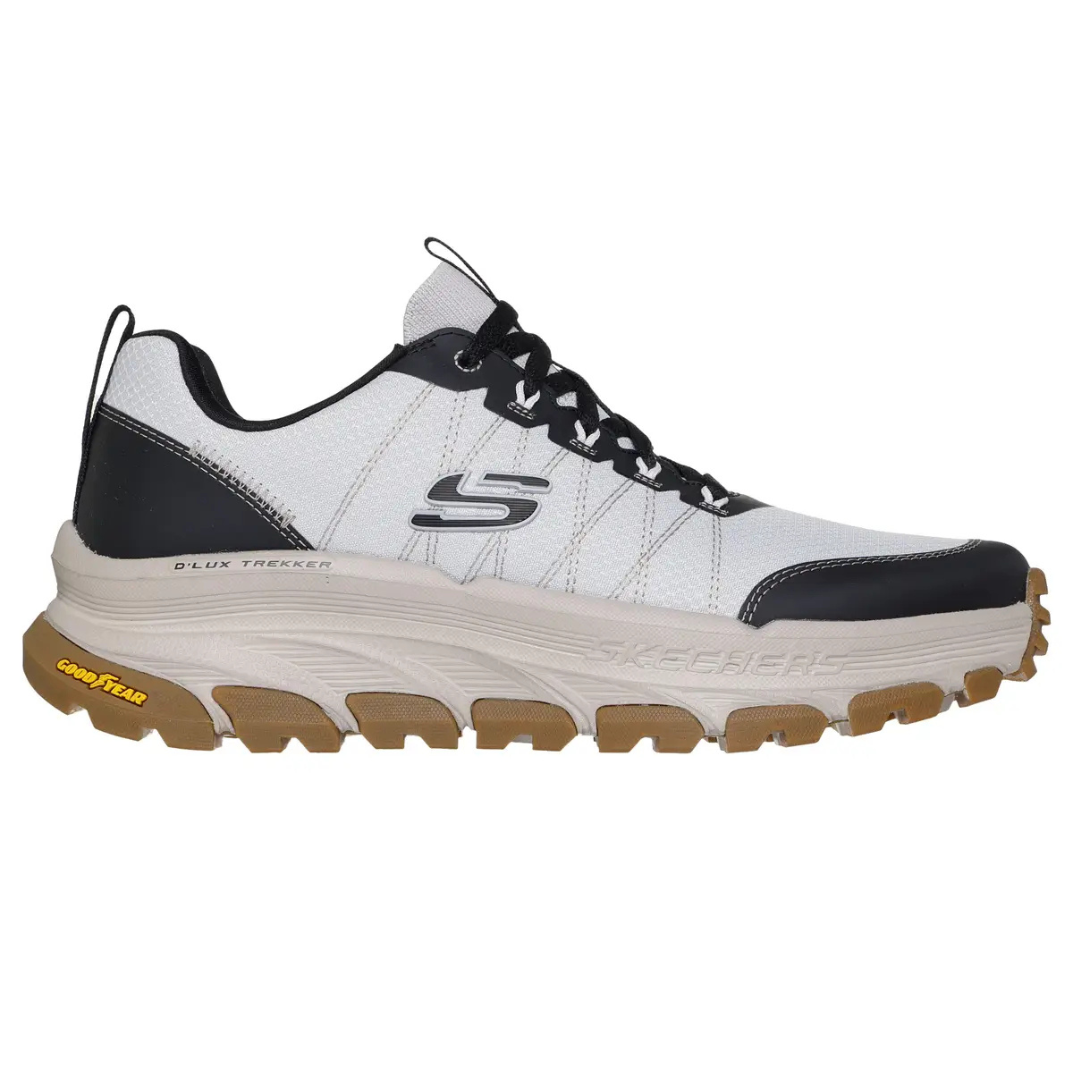 A black and white Skechers D'Lux Trekker shoe featuring a chunky sole with Goodyear branding on the gum outsole, suitable for outdoor activities.