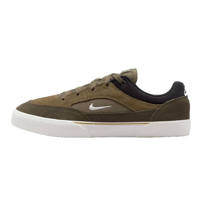 A low-top sneaker in brown and black with a white Swoosh logo and white sole. The shoe combines suede and mesh materials for a casual style.