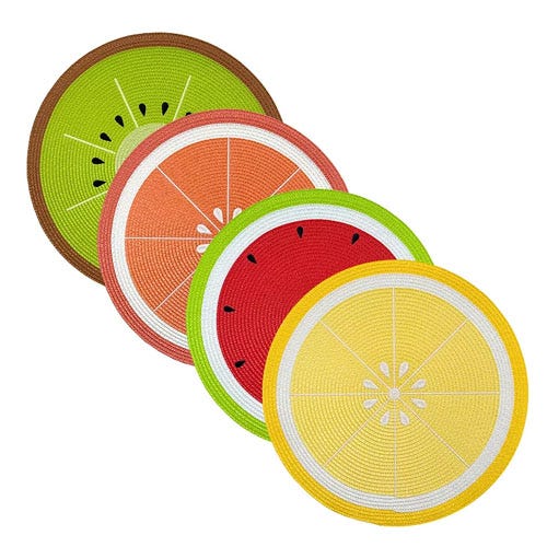 Four round woven coasters are designed to resemble fruit slices: kiwi, grapefruit, watermelon, and lemon.