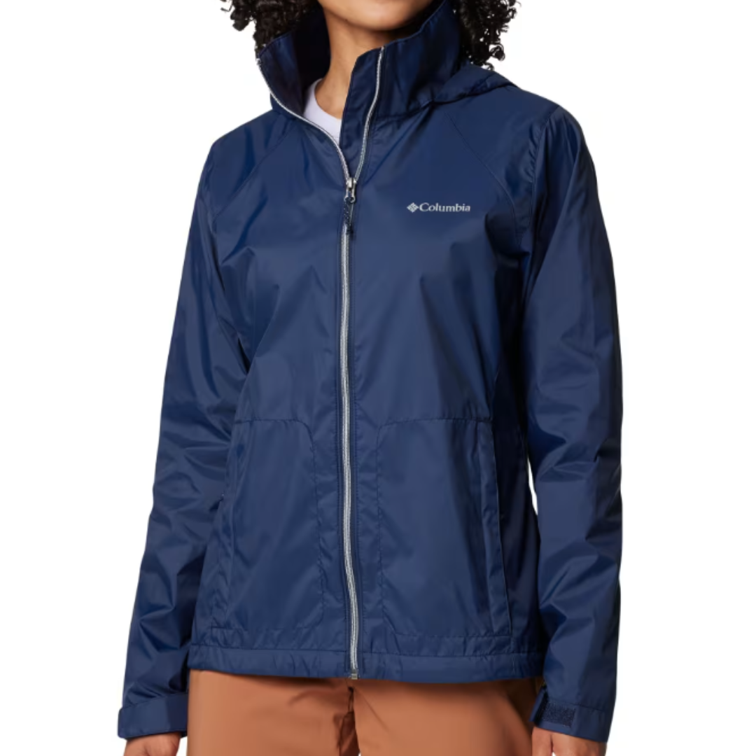 The Columbia Switchback IV Jacket is a women's lightweight, waterproof jacket in navy blue, featuring a zip-up front, high collar, and the Columbia logo on the chest. It is designed for weather resistance and casual outdoor wear.