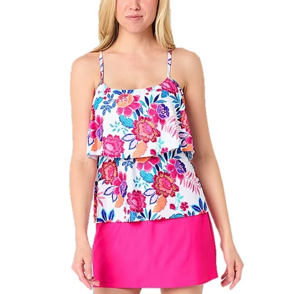 Floral tankini with adjustable spaghetti straps and layered ruffle top, paired with a bright pink swim skirt.