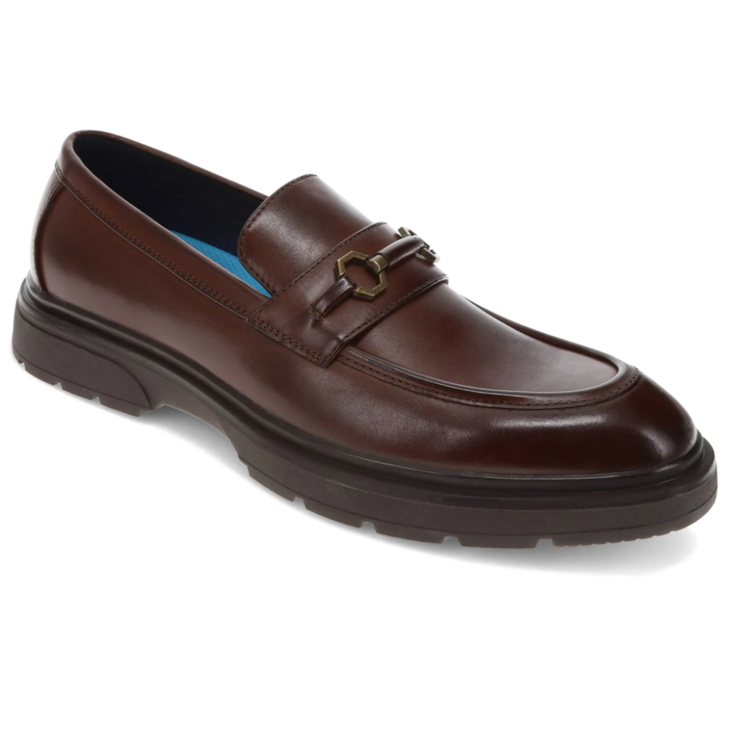 Dockers Thacher Shoes are brown leather loafers with a decorative metal bit on the vamp and a robust, black rubber sole, offering a blend of classic style and comfort.