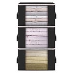 A three-drawer fabric storage organizer filled with neatly folded towels and sheets.