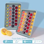 Two silicone ice cube trays with round compartments are shown, filled with colorful ice spheres made from fruits and berries, emphasizing their food-safe material, lack of odor, and BPA-free construction.