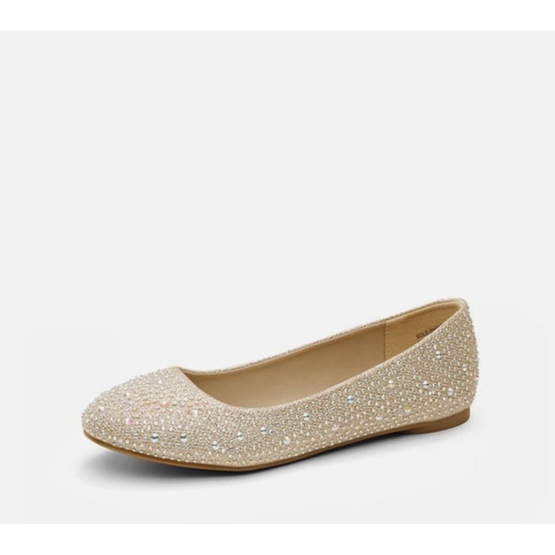 A sparkling flat shoe with rhinestone embellishments.