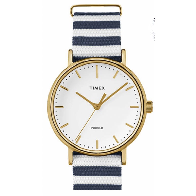 A Timex watch featuring a gold-tone case, white dial with gold-tone hands, Indiglo text, and a striped navy and white nylon strap.
