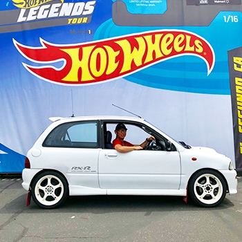 The Vivio parked in front of a Hot Wheel packaging display that is life-sized.