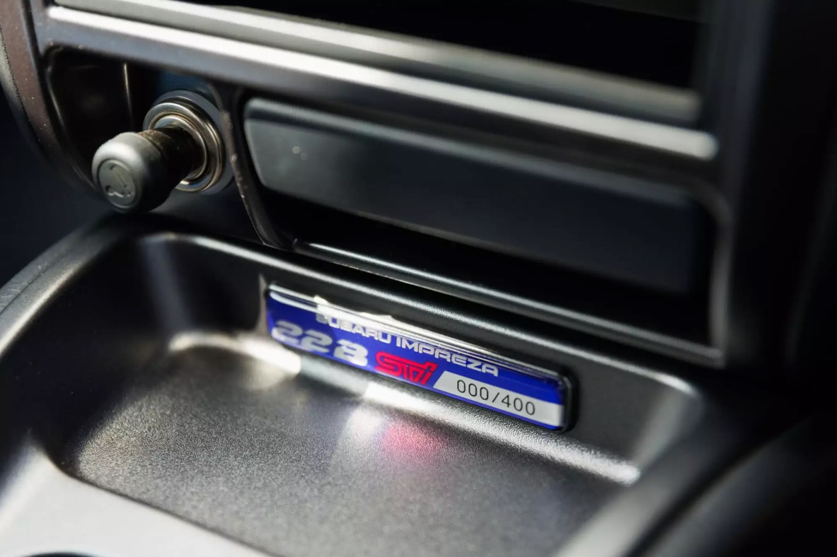 A close-up of a tag inside the vehicle that says, Subaru Impreza 22B STi, 000/400