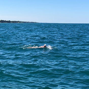 Elizabeth Fry swimming far from shore.