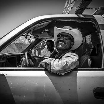 Smiling driver in old Subaru