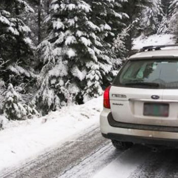 Subaru Outback driving in snow